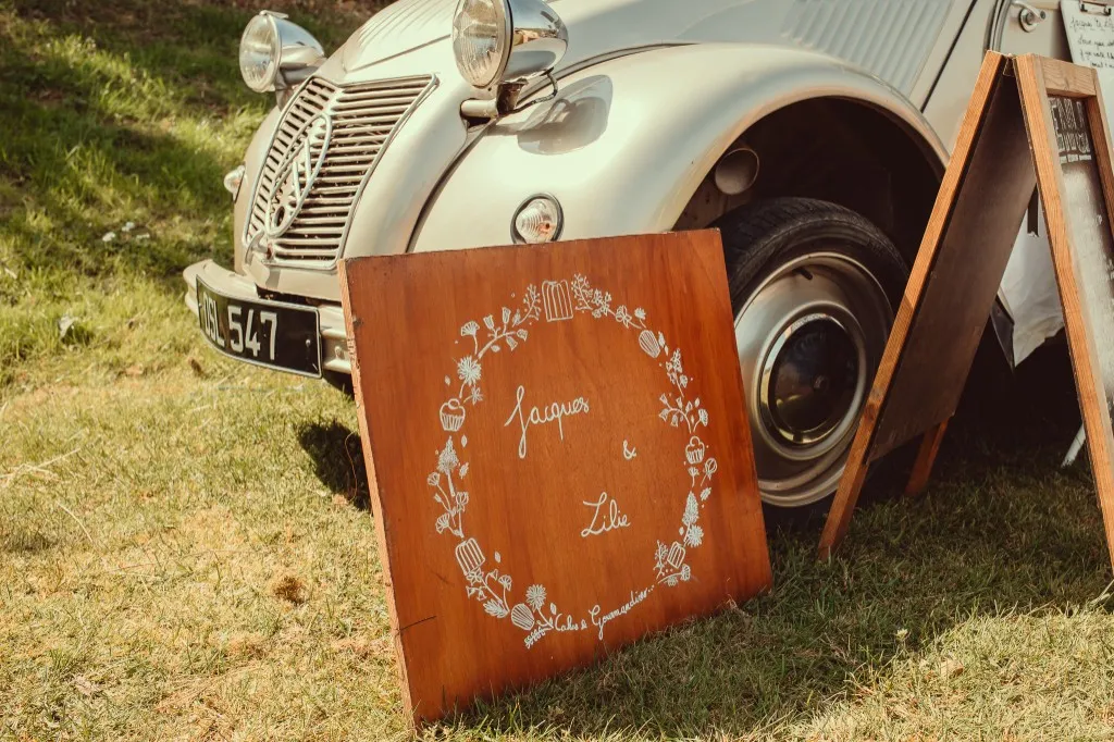 Supplier vintage car and signage on the lawn at a Woodhill dry hire wedding, Faversham, Kent
