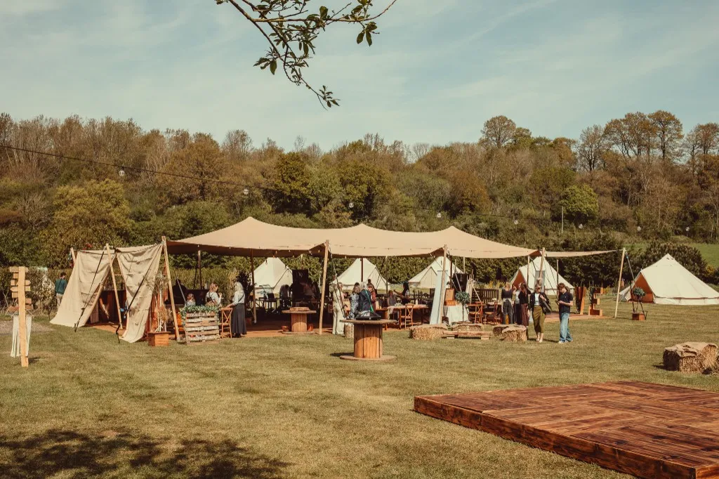 The Bedouin stretch tent and bell tents set up in the grounds at Woodhill Weddings, Faversham, Kent