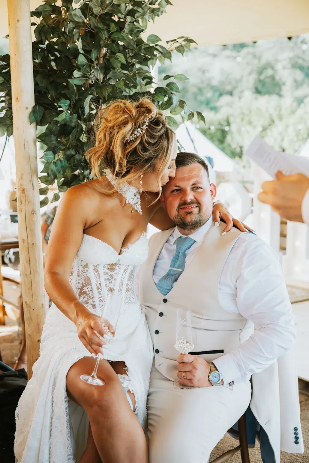 A bride kisses her groom during their celebrant-led ceremony at Woodhill Weddings, Faversham, Kent